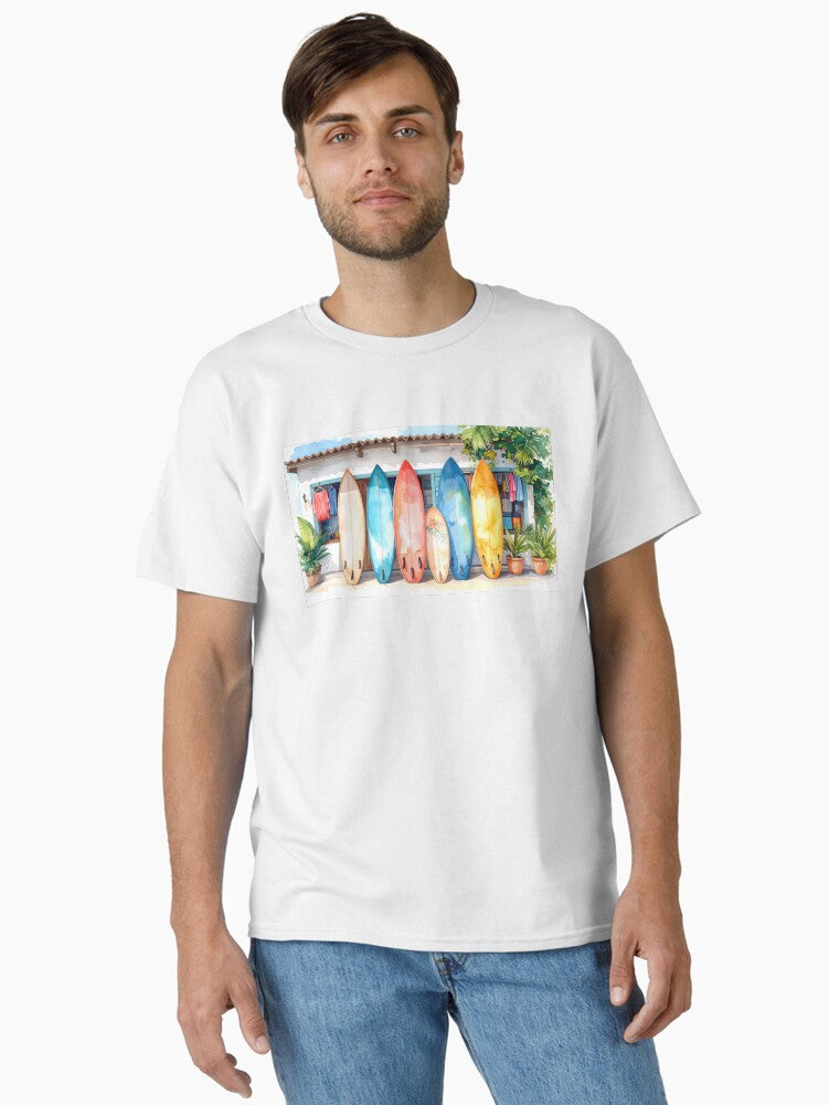 A colorful surfboard featuring shades of blue and white stands upright in soft warm sand Classic T Shirt T Shirt